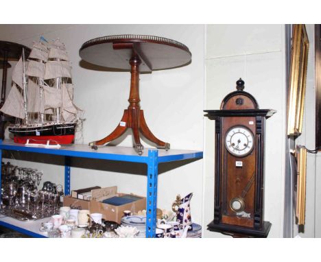 Victorian walnut and ebonised wall clock, circular mahogany leather and galleried top pedestal coffee table and model ship (3