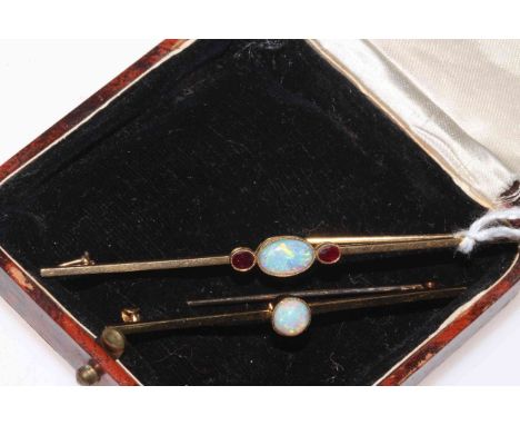 Two gold opal bar brooches, one with two rubies and one stamped 15 carat.