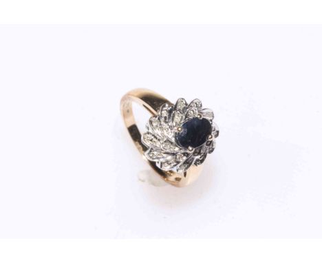 Oval sapphire and multi-stone diamond cluster ring set in 9 carat gold, size O.