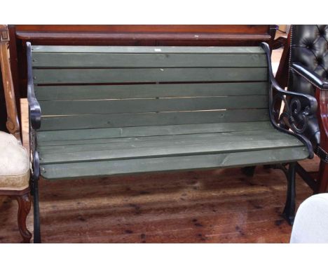 Cast and wood slat garden bench, 77cm by 133cm.