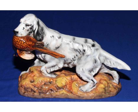 Royal Doulton model of an English setter carrying a pheasant, HN 2529, designed by Frederick Daws.