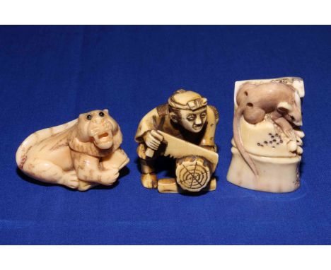 Three Japanese netsuke of woodcutter, mouse and tiger.