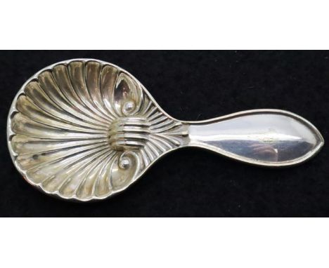White metal Victoria caddy spoon with a shell type bowl. P&amp;P Group 1 (£14+VAT for the first lot and £1+VAT for subsequent