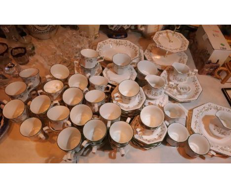 100 plus pieces of Eternal Bow pattern ceramic dinner and tea ware. Not available for in-house P&P, contact Paul O'Hea at Mai