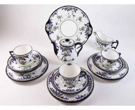A Royal Doulton Art Deco part tea service comprising teapot, jug, two teacups, one larger cup, seven various sized saucers, s