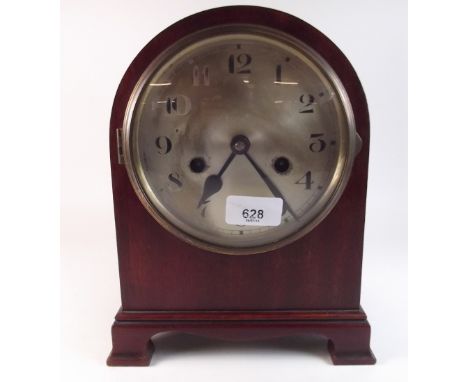 An Edwardian mahogany arch top mantel clock