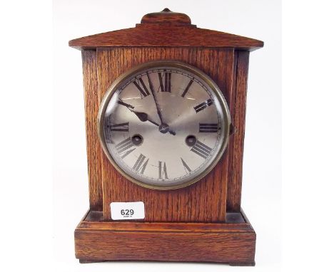 An oak 1920's/30's eight day striking mantel clock