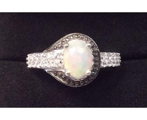 An Ethiopian opal with black spinel ring