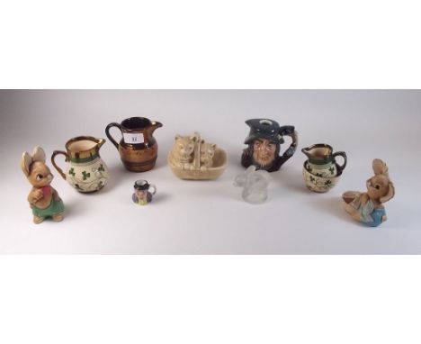 A Royal Doulton Rip Van Winkle flask, a Sylvac cat in basket group and various lustre jugs etc