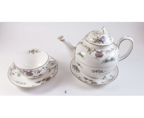 A Royal Worcester teapot 'Pekin' pattern W.9757, and a breakfast cup and three saucers