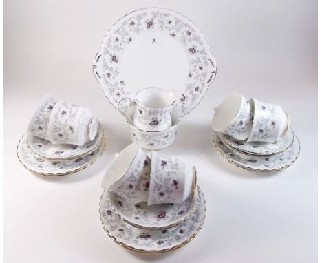 A Royal Stafford 'Enchanting' tea service comprising six cups and saucers, milk, sugar, six tea plates and a cake plate