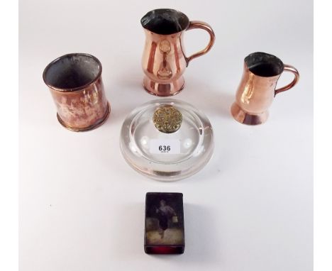 A Victorian glass inkwell with embossed brass lid three copper items and a lacquer vesta holder painted figure