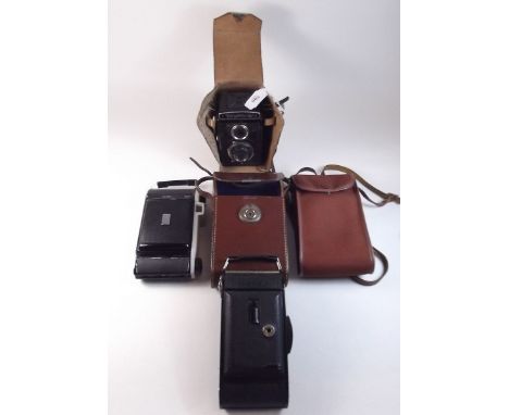 A Voightlander compass camera, Voightlander box camera and a Kodak Kodette