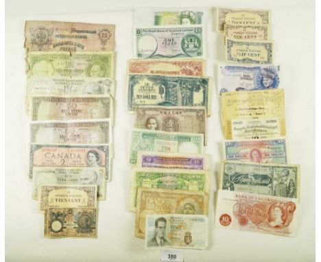 A wad of approx twenty five + world banknotes including: Bank  of England 10 shillings C90N, £1 green C07, Royal Bank of Scot