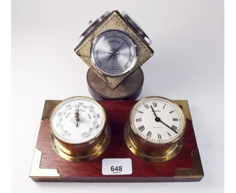 A 1960's German cube form barometer/thermometer and hygrometer with ships clock/barometer on mahogany plinth