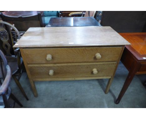 A light oak chest of drawers 
