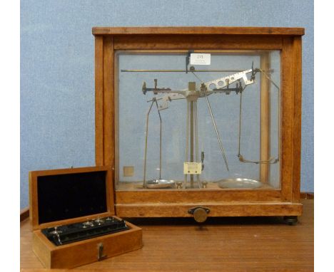 A cased set of Phillip Harris &amp; Co. scientific scales 