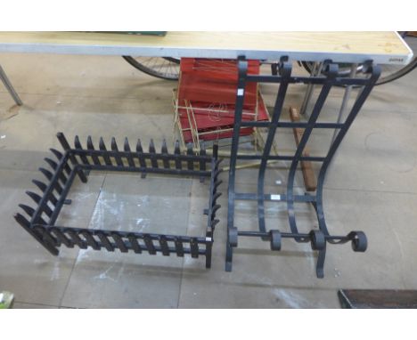 A wrought iron log basket and a fire grate frame 