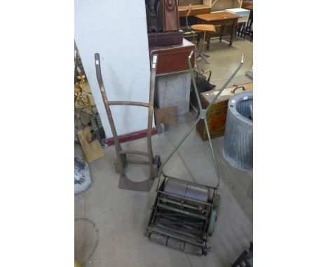 A vintage garden lawnmower and a sack barrow 