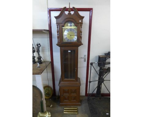 A hardwood triple weight longcase clock 