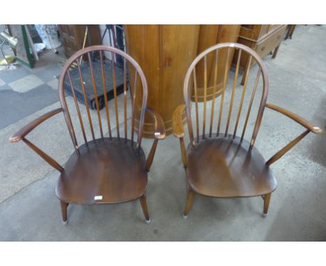 A pair of Ercol Golden Dawn elm and beech armchairs 