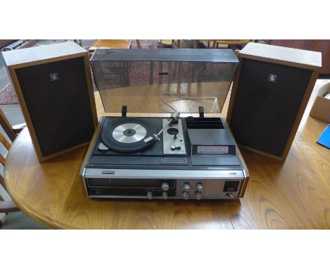 A Sanyo 8-track record player and radio with assorted 8-tracks and cleaner 