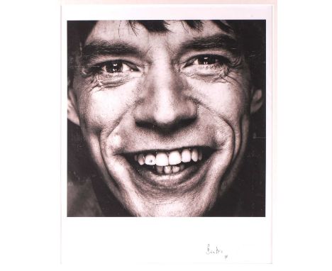 Brian Aris (contemporary), Mick Jagger with diamond tooth, a black and white photographic print, signed artists proof, studio