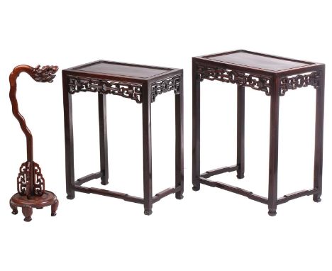 A nest of two Chinese Hongmu tables, early 20th century,of rectangular form with sunken top, with archaic style frieze, on sq