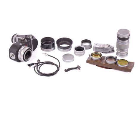 A collection of loose Leica photography accessories to include a Leitz Leica Visoflex, a Leitz Leica 90mm 1:4 Elmar chrome le