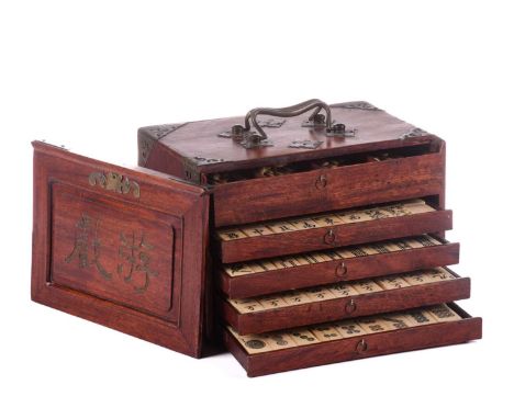 A Chinese Mahjong set, late Qing/early 20th century, complete with numerous bone sticks and bamboo backed bone tiles, dice an