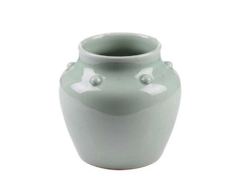 A Chinese celadon ware wide-mouthed jar, with raised circular bosses to the shoulders, bearing an apocryphal zhuanshu seal ma