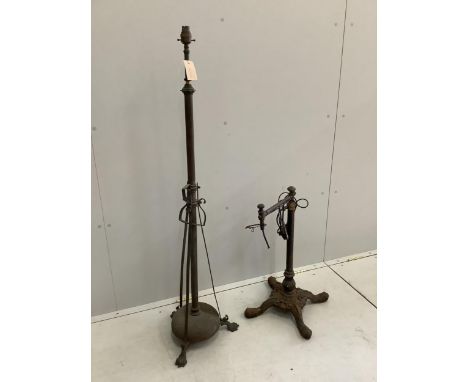 A Victorian brass telescopic standard lamp and a cast iron floor lamp. Condition - poor
