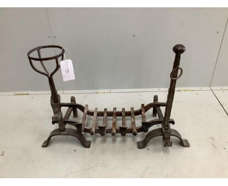 A pair of wrought iron fire dogs and grate, width 82cm, depth 36cm, height 62cm. Condition - good