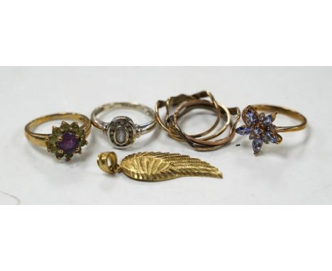 A modern 14k and gem set cluster ring, size L, gross weight 2.5 grams, together with three assorted 9ct rings, including gem 