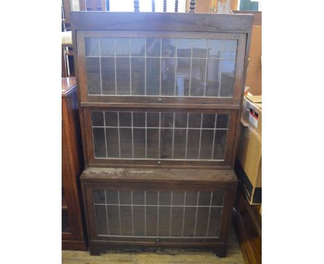 A Globe Wernicke style three tier bookcase with leaded light panels, width 34", depth 15" x height 57" (all measurements appr