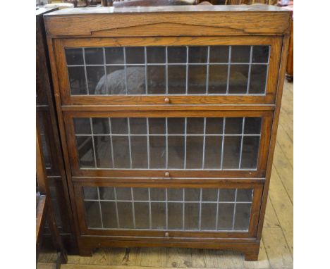 A pair of Oak Globe Wernicke style three tier bookcases with leaded light panels, width 34", depth 11" x height 45" (all meas