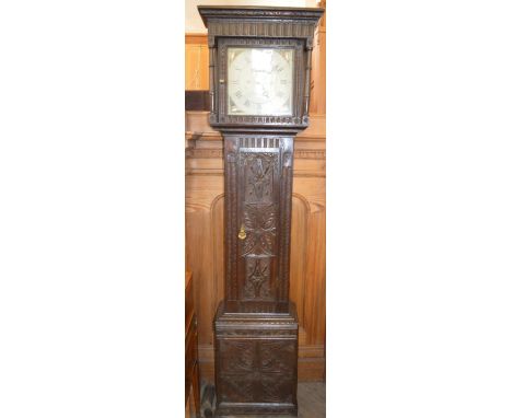 A 19th Century Oak carved thirty hour longcase clock with painted dial by T. Davis, Bampton, dial dated 1818