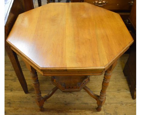 An Edwardian octagonal occasional table with gallery shelf below