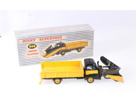 Dinky Supertoys 958 Guy Warrior snow plough with yellow black body and plough blade, in striped pictorial box.