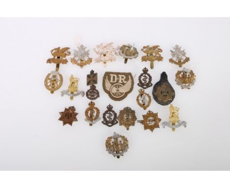 Twenty-two military cap and other badges including Essex Regiment, Notts and Derby, York and Leicester, The Buffs, Army Servi