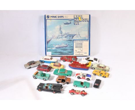 Playworn diecast model vehicles incluidng Corgi Land-Rover 109 WB Safari, 007 Lotus Esprit, Batmobile, Ferrari Formula 1 car,