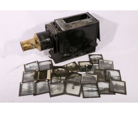 Late Victorian magic lantern with twenty-three square plate glass slides circa 1900 including views of hot air balloon, paddl