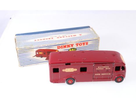 Dinky Supertoys 981 horse box with maroon body, British Railways logo, red grooved hubs, in striped pictorial box.
