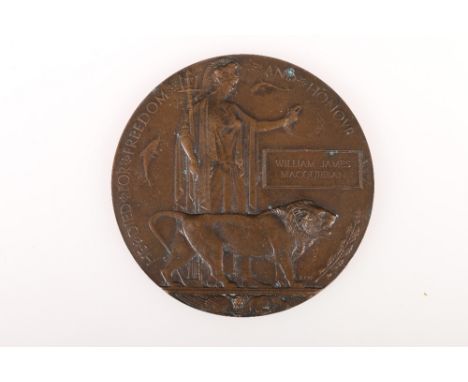 WWI death plaque or deadman's penny to William James Macquibbon with number 21 stamped at left hand side above exurge.