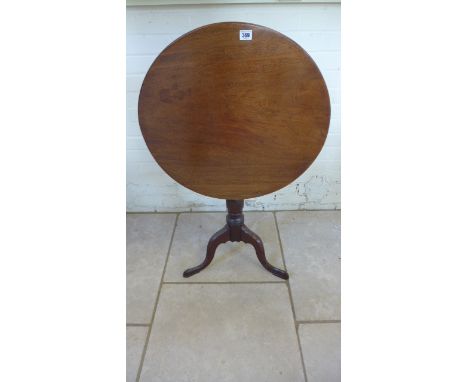 A 19th century mahogany tilt top side table on a tripod base the top is warped - Height 72cm x Diameter 61cm 