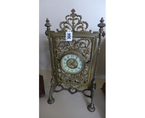 A brass French 8 day clock with Arabic numerals to white enamel dial - reg no 152580 