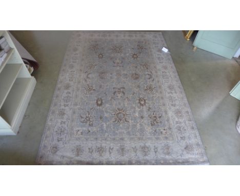 A blue ground hand made wool Agra carpet - 2.30m x 1.60m