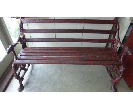 A rare antique wrought iron garden bench - Wooden slats supported by iron work depicting entwining serpents, bunches of grape
