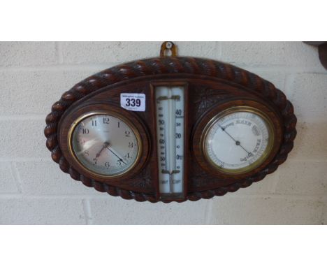 An oak cased rope twist clock/barometer and thermometer