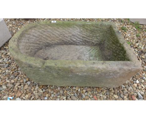 A carved stone planter - Height 28cm x 68cm x 43cm 